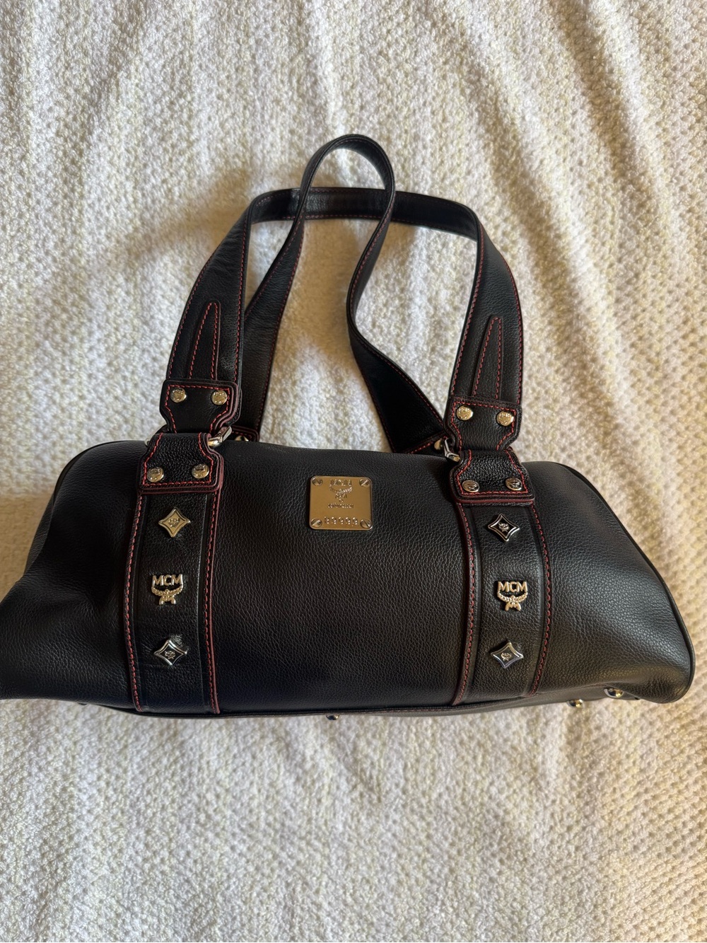MCM Black Leather Shoulder Bag with Red Stitching and Gold Plaque